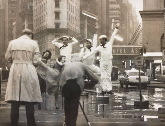 Gordon Parks (leaning over tripod) photographs original “Fancy Free” cast members Muriel Bentley, Janet Reed, Harold Lang, John Kriza and Jerome Robbins during a Times Square reunion in 1958. Silver gelatin print. Photographer unknown. Jerome Robbins Dance Division, The New York Public Library for the Performing Arts