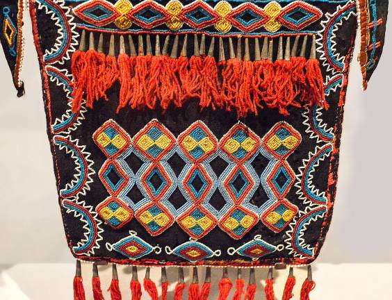 An artist from the Delaware people in Kansas, ca. 1840, created this vibrantly designed beaded bag used in formal men’s attire. Photo: Adel Gorgy.