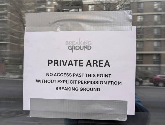 Entrance to 320 Pearl St. homless shelter, Southbridge Towers reflecting.