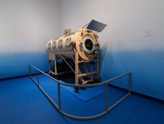 An iron lung used to treat polio. Photo courtesy of the Museum of the City of New York