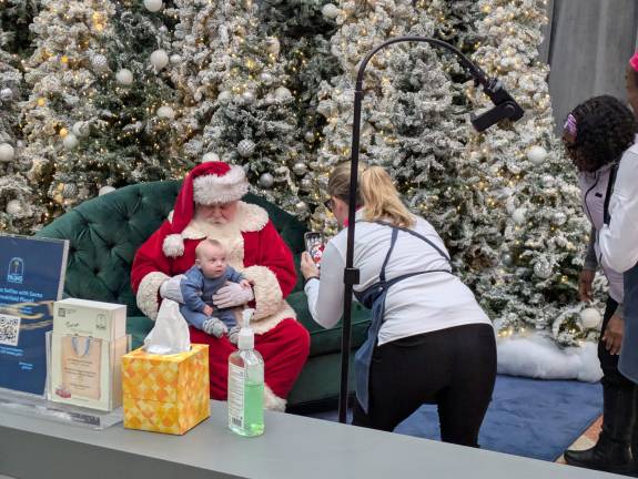 Santa Claus and baby at Brookfield Palace.