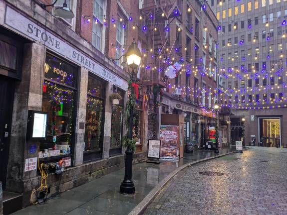 Stone Street on a wet December day, looking south to 85 Broad St.