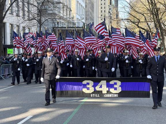 Since the first parade after 9-11, the FDNY has marched with 343 flags, symbolizing the number of firefighters who died that day nearly 25 years ago.