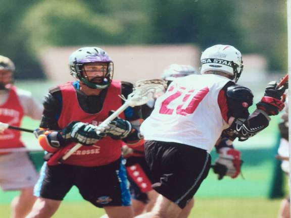 Stephan Russo (in red jersey) in <saxo:ch value="226 128 168"/>Past Masters action at Lake Placid. Photo courtesy of Stephan Russo