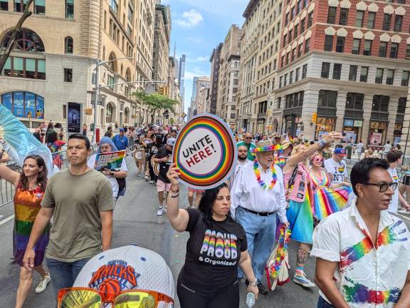 NYC Pride March stepping down Fifth Avenue.