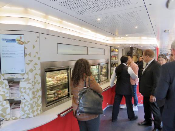 In the NextGen Acela cafe car, grab-and-go food and beverage offerings are available for purchase. There are microwaves to heat items up in the enclosed middle section.