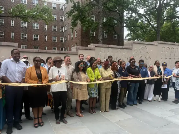 Aug. 7 ribbon cutting for Roland Barthé frieze restoration and reopening.