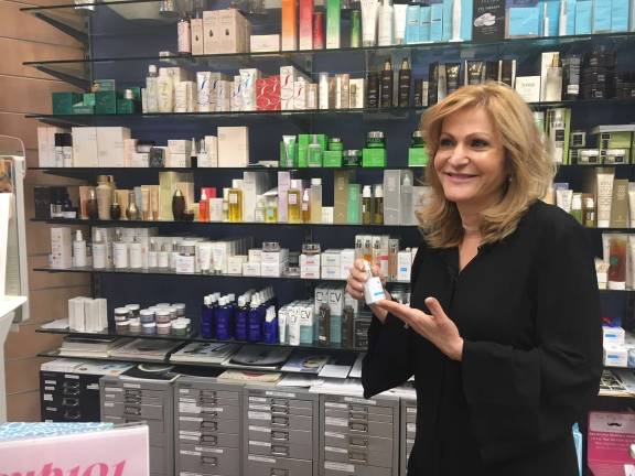 Abby Fazio, the owner of New London Pharmacy, on Eighth Avenue and 23rd Street, has hired specialists for each of the pharmacy’s several departments. Photo: Michael DeSantis