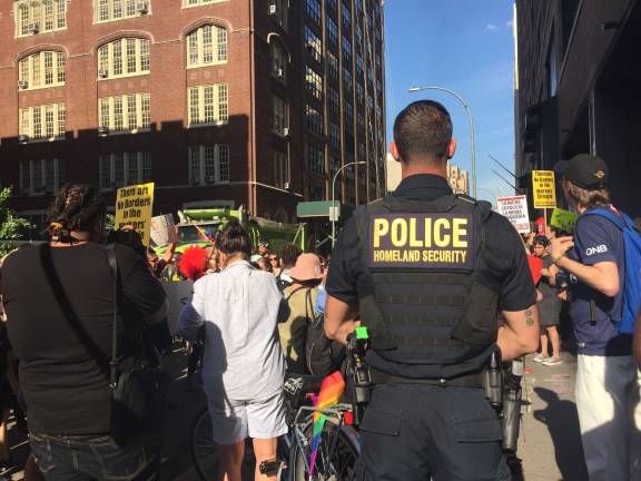 Federal police officers monitored the protest outside the immigration office. Photo: Natasha Roy