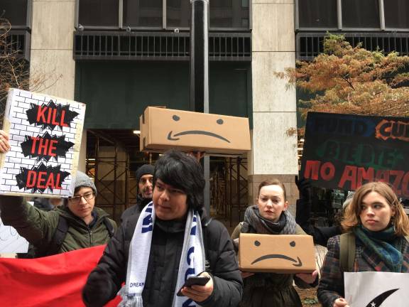 Students turn Amazon boxes into protest signs outside the office of CUNY Board of Trustees Chairman William C. Thompson, Jr. on Wall Street. Photo: Orla McCaffrey