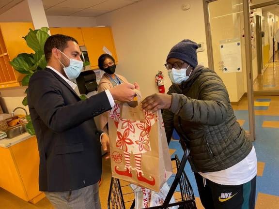 Council Member-Elect Christopher Marte Distributing Meals at the Manny Cantor Center. Photo courtesy of Educational Alliance