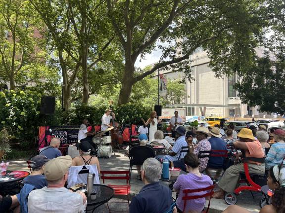 Vocalist Kathryn Farmer energizes the crowd in Dante Park on July 9.