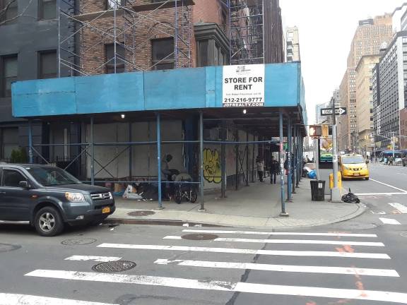 The sidewalk shed has long served as a destination for people who have chosen to live on the streets instead of seeking shelter. Photo: Scott Stiffler