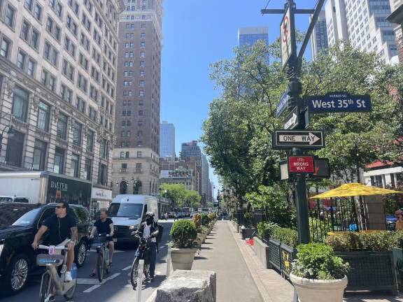 The new plan marks the second proposal to expand bike lanes along Sixth Avenue (above) this Summer.