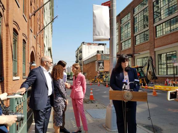 Sarah Carroll (right), pictured here at the unveiling of a new marker in the DUMBO Historic District in Brooklyn, is Mayor Bill de Blasio's pick to lead the Landmarks Preservation Commission. Carroll has served on the LPC staff for over two decades. Photo: NYC LPC, via Flickr