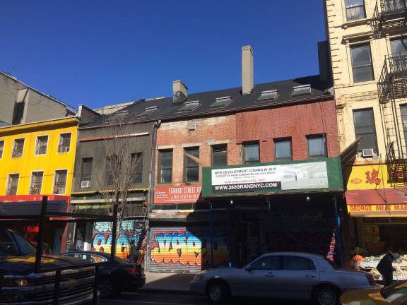 Gallerist Marc Straus plans on demolishing this row of Federal-era buildings on Grand Street near Allen Street in Chinatown in favor of an 8-story condo and gallery development. Photo: Lily Haight