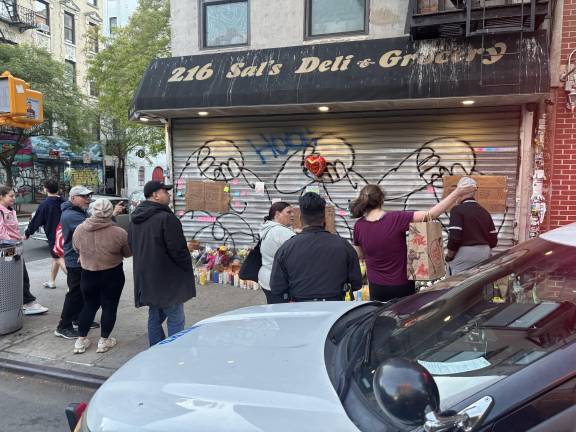 Two days after the shooting incident that left Abdul Saleh dead, neighbors continue to flock to the Sal Deli &amp; Grocery where he worked as the memorial grows. Unbeknownst to most of the mourners, police had arrested someone on Sunday April 26 for the shooting death that happened on April 25.