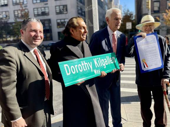 <i>Godfather</i> actor Gianni Russo holding Dorothy Kilgallen Way sign; to Robert Holden’s right, author Mark Shaw holding proclamation. At far left is Frank Morano, Council member from Staten Island and longtime radio host, who called Kilgallen a “trailblazing reporter.”