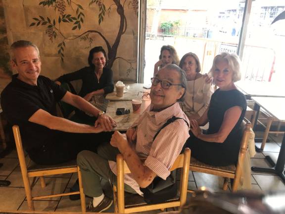 Sandro Manzo (in front, with glasses) and friends at Juliano's. Photo courtesy of Michele Willens