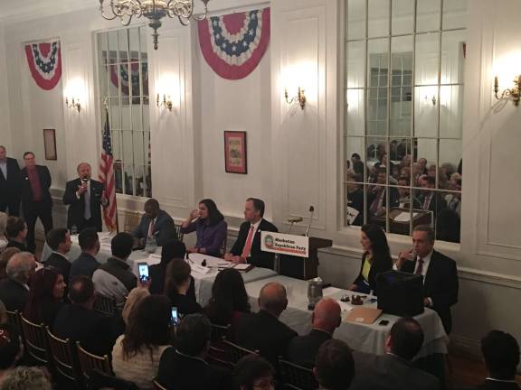 Bo Dietl, with the microphone, was among four Republicans candidates making their cases at the Metropolitan Club to be the GOP nominee in this year's mayoral contest. Other candidates at the Wednesday night forum were, from Dietl's left, Michel Faulkner, Nicole Malliotakis and Paul Massey. The Manhattan Republican Party's chairwoman, Adele Malpass, seated at right, moderated. Photo: Madeleine Thompson  