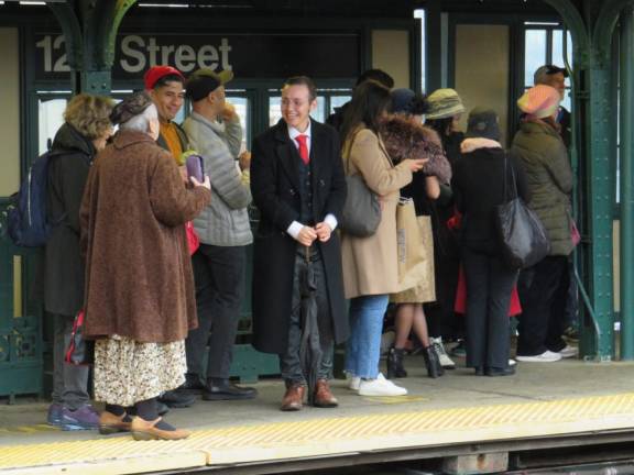 At the West 125th Street/Broadway Station, a costumed rider waits for the train on November 27, 2022, as he chats with another participant. Photo: Ralph Spielman