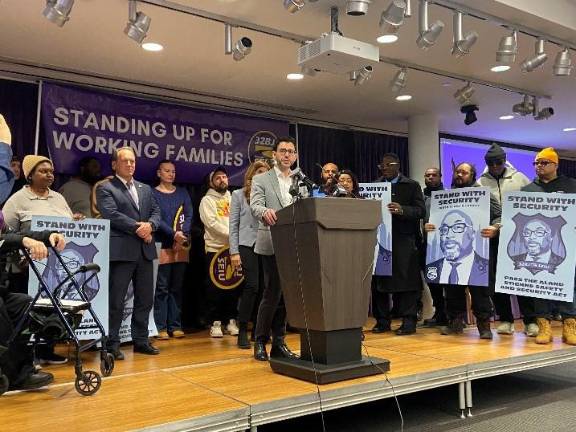 Unlike Eric Adams who vetoed the bill,, Mayor Zohran Mamdani supports the wage and benefits bill named for a security guard who was killed in a mass shooting last year. Sam Levine, the Commissioner of Consumer and Worker Protestion, expresses support at the 32BJ press conference.