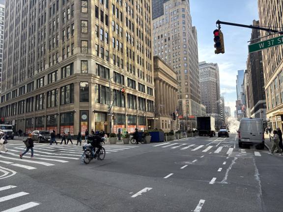 E-bikers such as the one above on Seventh Ave. last week, were routinely ignoring red lights even before Mayor Mamdani took away the criminal summons penalty for bike traffic infractions. The relaxed standards take hold on March 27.