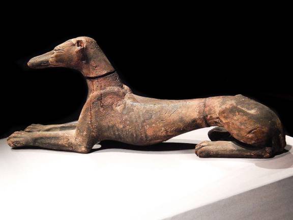 A wooden figure of a jackal from ca. 1070 – 664 B.C., Egypt, reminds us of how familiar a distant culture can be. Photo: Adel Gorgy