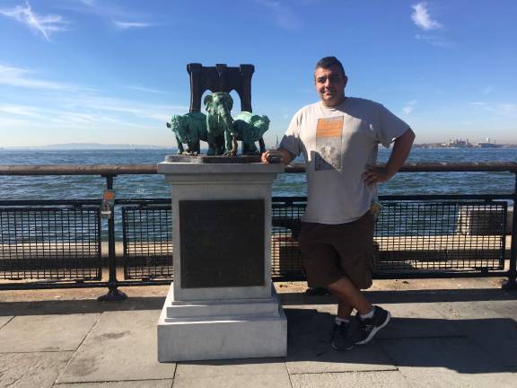 Joseph Reginella in Battery Park, next to his monument to the “the biggest land mammal tragedy in the nation.” Photo: Mihika Agarwal