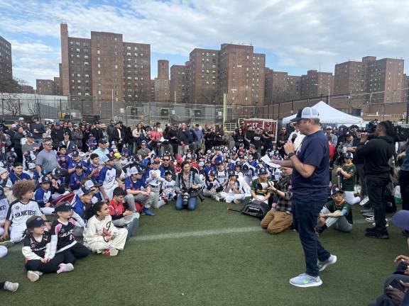 PSLL president Nick McKeon, at mic on opening day for the 75th season of the Peter Stuyvesant Little League which plays its games at historic Con Ed Field and nearby Murphy’s Brother’s Park. He said that the league registered 600 kids from a district whose boundaries run from E. 12th St. to E. 72nd St. between Fifth Ave. and the East River.