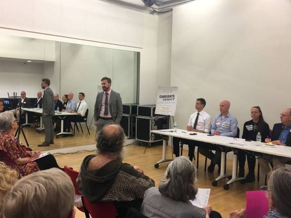 At a Monday night forum, candidates for City Council Districts 1 and 2 answered questions on preservation from residents and activists. Photo: Madeleine Thompson 