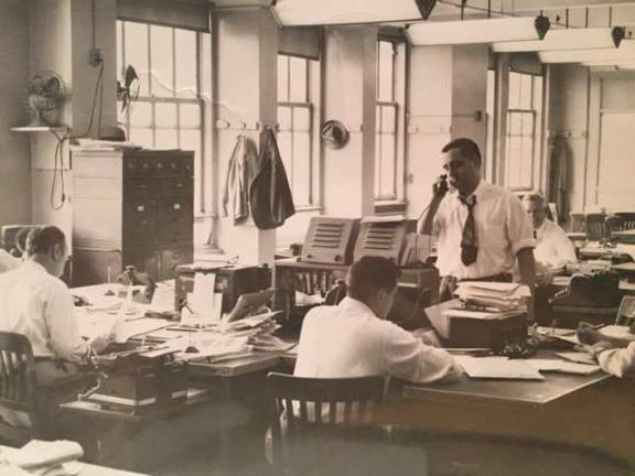 The Daily News's City Room in the early 1950s. Standing is longtime press agent, publicist and political fixer Morty Matz, then an assistant picture assignment editor at the paper. Photo: Collection of Morty Matz