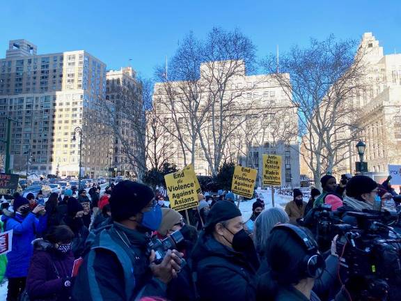 Crowd holding signs demanding the end of anti-Asian hate. Photo: Ava Manson