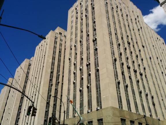 The suspect was being held at 100 Centre St. when he experienced a medical emergency and died.