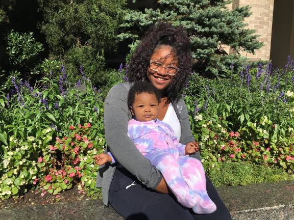 Zaiane Alawade holds her 14-month-old daughter, Naiilah, in her arms. Photo courtesy of Nurse-Family Partnership