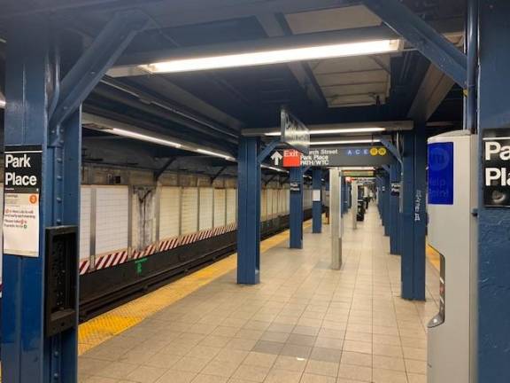 I decided to walk up Broadway to catch the #2 Express train at Park Place Station, across from City Hall. There were a few people on the street. Again, most retail stores were closed to customers. At about 12:30 p.m., there were few subway riders evident.