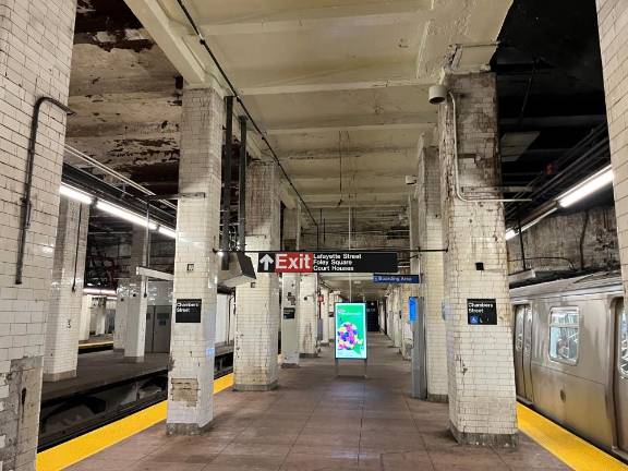 Should you be waiting for a J/Z train at Chambers Street, you are thankful for the broad spaces at eye level and overhead. What will give you pause are missing tiles on the columns, peeling paint on the ceiling and soot and grit from the financial hardship for the MTA to keep the station clean.
