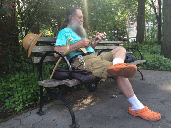 &quot;Mandola Joe&quot; Ornstein plays mandolin in Theodore Roosevelt Park. &quot;This has been a place where I have not only enjoyed the nature, but I taught myself to appreciate it in here,&quot; he said. Photo: Gabrielle Alfiero