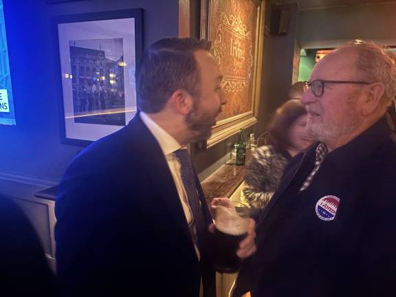 After his landslide victory in the special election, Keith Powers, his mitt firmly wrapped around a pint of Guinness, shares a joke with Kevin Kelly (full disclosure, he is the brother of EIC Keith J. Kelly). Vanessa Aronson, who hopes to join Powers in the Assembly, is in the background.