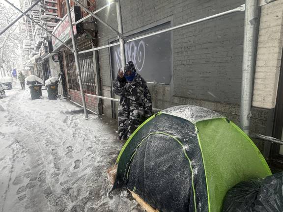 A homeless man outside a tent in the East Village. Mayor Mamdani is undertaking outreach to the city’s homeless population after 19 people died on city streets in the aftermath of the Jan. 24 storm.