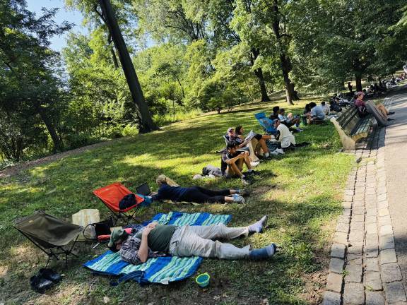 It was the second day of the Shakespeare in the Park on Friday, Aug. 8 and people began lining up at 4 a.m. for the free tickets for that evening’s performance. There was a lot of camraderie among people on line who settled down for hours.