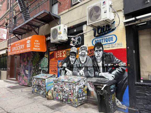 Direectrly Opposite 126 Ludlow St., a mural honoring the Beastie Boys “Paul’s Boutique” and this specific corner, 99 Rivington St.