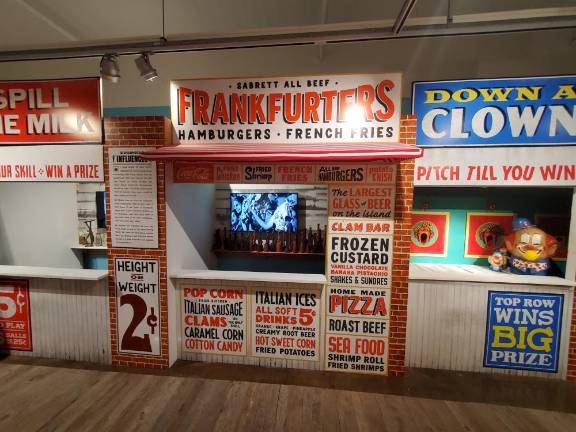 <b>Upon walking into the “Wilde Mind” exhibition, faux storefronts like these immerse visitors in the Coney Island of Wilde’s youth.</b> Photo: Oscar Kim Bauman