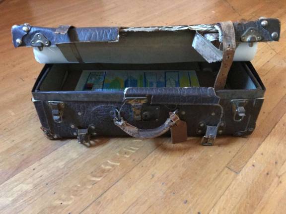 A suitcase, typically a symbol of arrival and of hope, takes on yet other, somber meaning as more immigrants are being deported. Photo courtesy of Lourdes Bernard