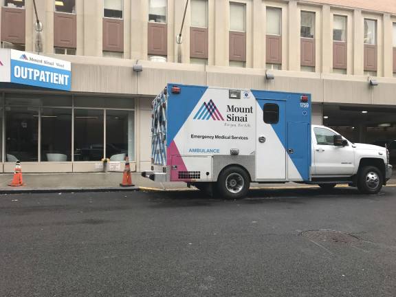 An ambulance on West 59th Street between Ninth Avenue and Tenth Avenue after transporting a patient to the emergency room of Mount Sinai West on Sunday, February 4th. Photo: Douglas Feiden 