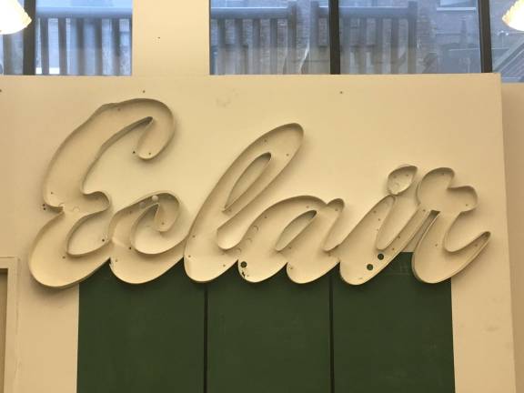 All that remains of the Café Éclair is this fragment of its old sign, which hangs in the office of Landmark West! Photo: Courtesy of Landmark West!