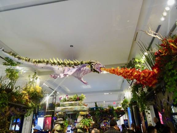 A centerpiece of Macy's Flower Show this year is a dragon breathing fire (orange lilies), and melting the ice and snow. Photo: Clarrie Feinstein