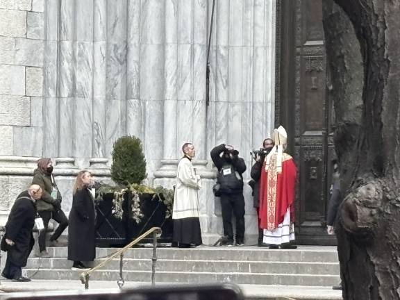 New archbishop Ronald Hicks, in accordance with tradition, has to knock on the huge bronze doors of St. Patrick’s Cathedral three times before he’s admitted to his installation Mass on Feb. 6.