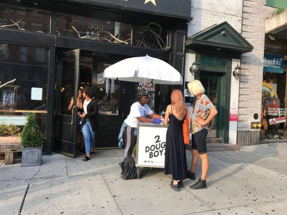 Shanya Rodriguez of 2DoughBoyz serving fresh flavor outside the Gansevoort Market on West 14th Street. Photo: Charmaine P. Rice