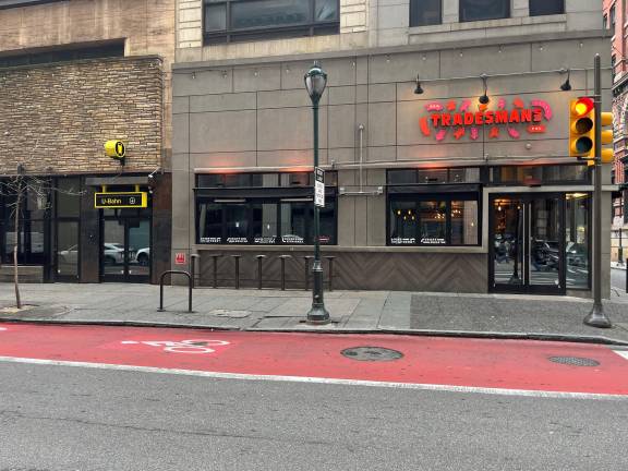 A tale of two spaces: On the left, the look of the subterranean bar U-barn is loosely based on the German underground subway systems; next to it is 200-seat Tradesmans, part BBQ restaurant, part sports bar. Both reflect the ever-changing food and bar scene in Philadelphia.